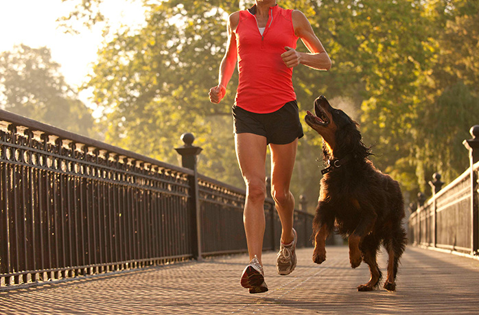 dog and woman run